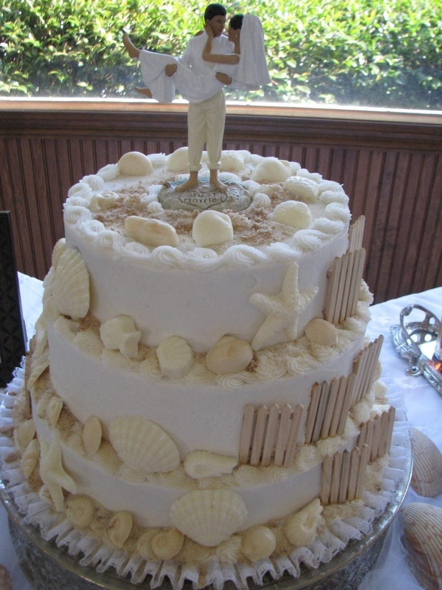white wedding cake with beach theme